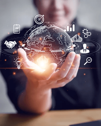 Hand holding a glowing digital globe surrounded by business growth icons and statistics
