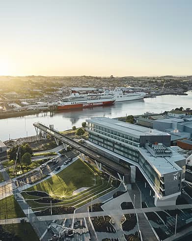 Aerial view of a passenger ferry docked on the riverfront